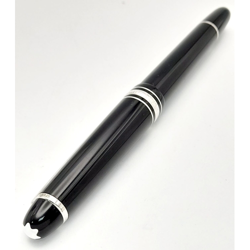 976 - A Montblanc Meisterstuck Fountain Pen. Black lacquer and silver tone decoration. 14k gold nib. 14cm.