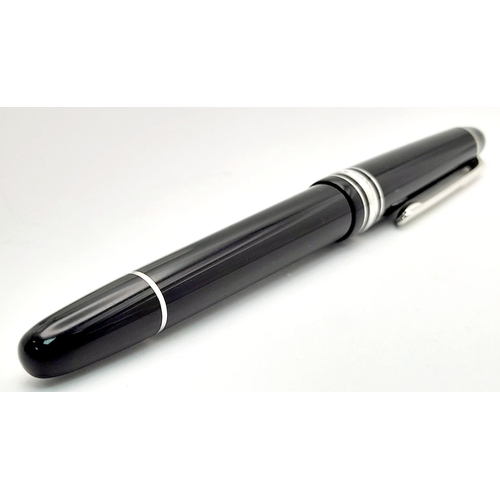 976 - A Montblanc Meisterstuck Fountain Pen. Black lacquer and silver tone decoration. 14k gold nib. 14cm.