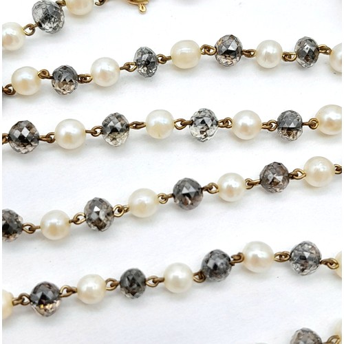 395 - AN 18K GOLD SEED PEARL AND CRYSTAL NECKLACE .   4.8gms    46cms