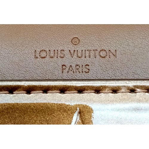 78 - A Louis Vuitton Patent Bronze Leather Handbag. LV decorative monogram exterior with gold tone hardwa... 