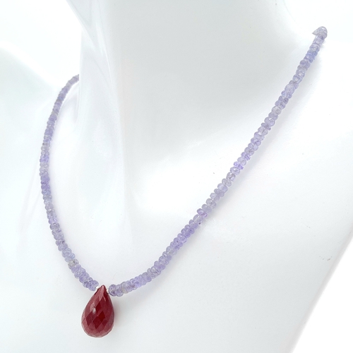 1113 - A 60ctw Tanzanite Single Strand, Ruby Drop Necklace. 925 Silver Clasp. 44cm. Ref: CD-1281