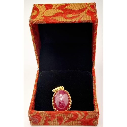 1091 - A Mozambique Ruby Cabochon Pendant with a Rose cut Diamond Bail. 39.35ct ruby. Diamonds - 0.10ctw. 3... 