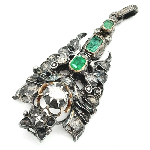 1177 - An Antique Silver Emerald and Diamond Pendant. An ornate piece with rich emeralds and old cut diamon... 