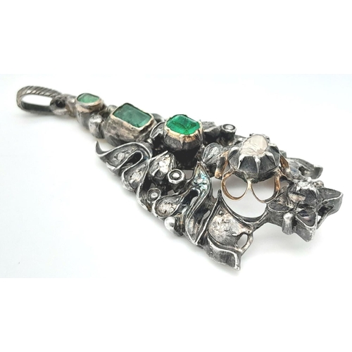 1177 - An Antique Silver Emerald and Diamond Pendant. An ornate piece with rich emeralds and old cut diamon... 