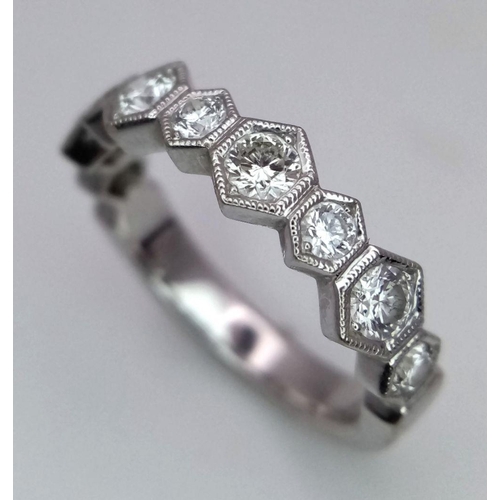 1009 - A 9K White Gold Diamond Half Eternity Ring. Hexagonal diamond links. Size L. 3.3g total weight.