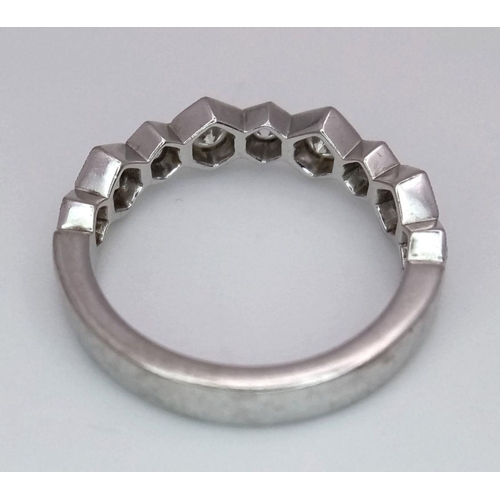 1009 - A 9K White Gold Diamond Half Eternity Ring. Hexagonal diamond links. Size L. 3.3g total weight.