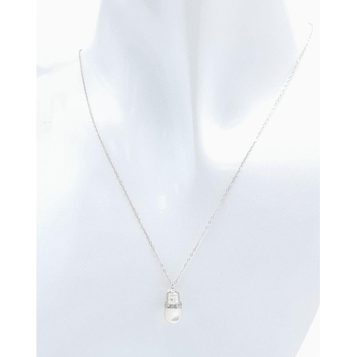 1212 - An 18K White Gold LightBulb Designed Moonstone Pendant! Comes on a delicate 9k white gold necklace. ... 