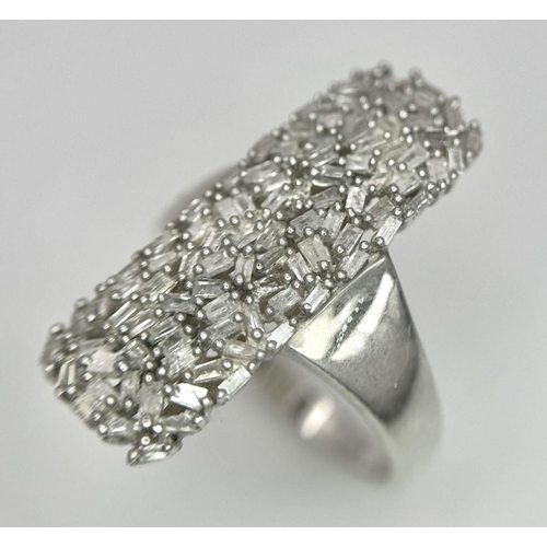 988 - A 925 Silver Diamond Cluster Ring. Elongated shape with pave diamond setting. Size T. 5.5g