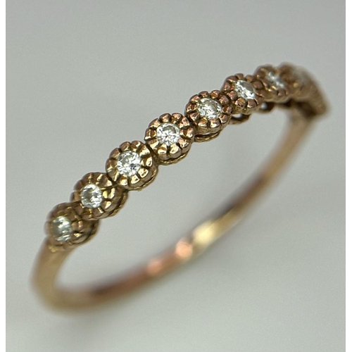 820 - Two 14K Gold Half Eternity Diamond Rings. Rose and white gold. Both size M. 2.25g total weight.