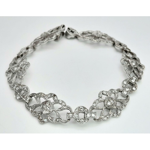 792 - An Art Deco Platinum and Diamond Bracelet. Old cut diamonds - 3ctw. 17.3g total weight. 18cm length.