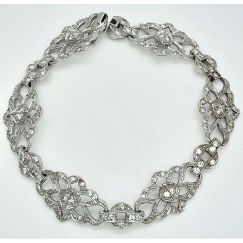 792 - An Art Deco Platinum and Diamond Bracelet. Old cut diamonds - 3ctw. 17.3g total weight. 18cm length.