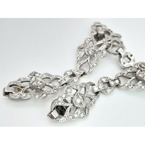 792 - An Art Deco Platinum and Diamond Bracelet. Old cut diamonds - 3ctw. 17.3g total weight. 18cm length.