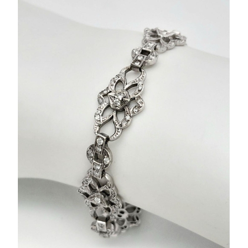 792 - An Art Deco Platinum and Diamond Bracelet. Old cut diamonds - 3ctw. 17.3g total weight. 18cm length.