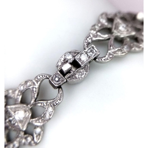 792 - An Art Deco Platinum and Diamond Bracelet. Old cut diamonds - 3ctw. 17.3g total weight. 18cm length.