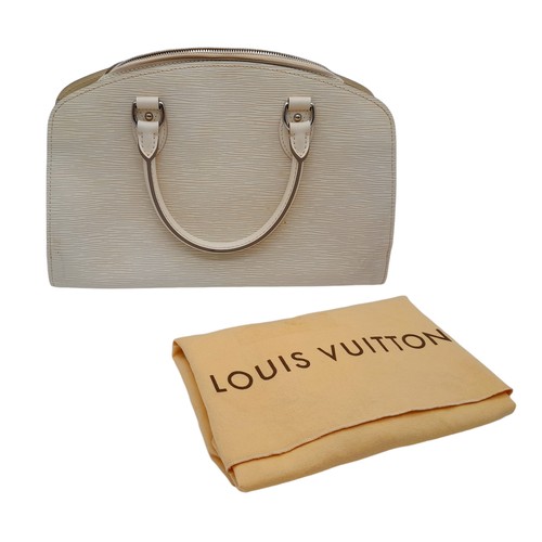 185 - A Luxury Louis Vuitton Alma White Epi Leather Bag. Textured exterior with LV monogram to corner. Sof... 