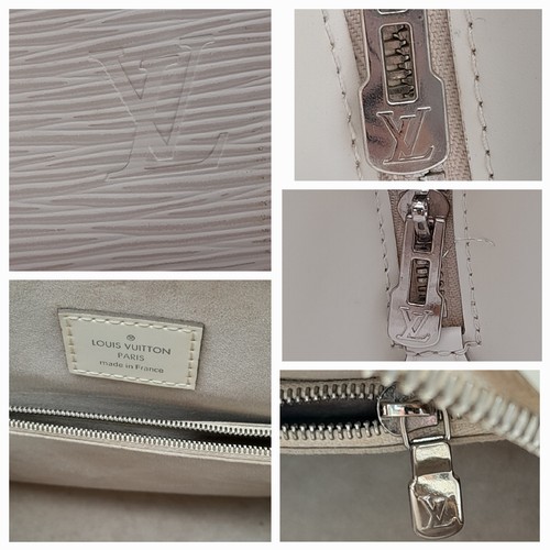 185 - A Luxury Louis Vuitton Alma White Epi Leather Bag. Textured exterior with LV monogram to corner. Sof... 