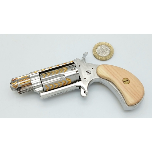 1429 - A Deactivated North American Miniature .22 Calibre Revolver. Gilded decoration. Comes with a fitted ... 