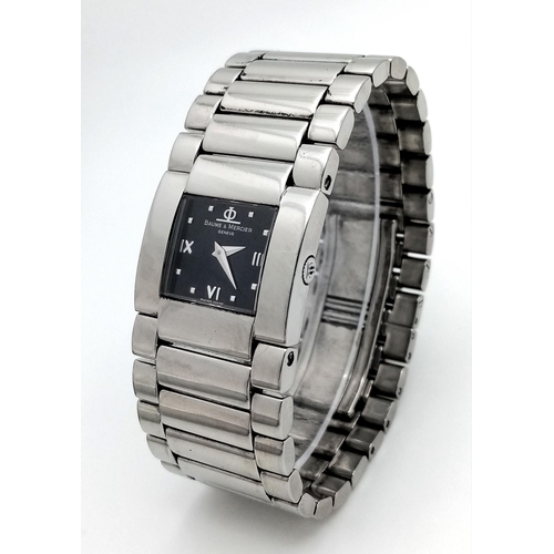 1527 - A BAUME AND MERCIER LADIES WATCH IN STAINLESS STEEL WITH STUNNING BLACK DIAL AND QUARTZ MOVEMENT .