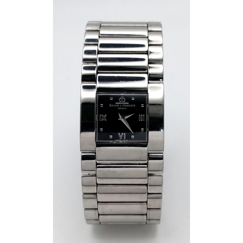 1527 - A BAUME AND MERCIER LADIES WATCH IN STAINLESS STEEL WITH STUNNING BLACK DIAL AND QUARTZ MOVEMENT .