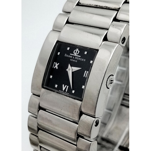 1527 - A BAUME AND MERCIER LADIES WATCH IN STAINLESS STEEL WITH STUNNING BLACK DIAL AND QUARTZ MOVEMENT .