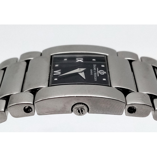 1527 - A BAUME AND MERCIER LADIES WATCH IN STAINLESS STEEL WITH STUNNING BLACK DIAL AND QUARTZ MOVEMENT .