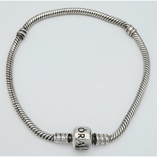 1402 - A PANDORA SILVER BRACELET .   14.5gms