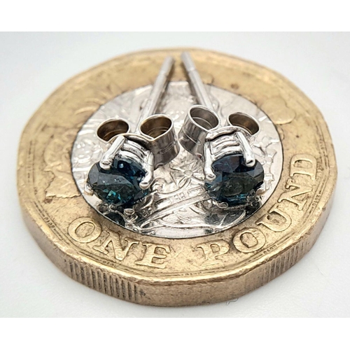 688 - A PAIR OF 9K WHITE GOLD BLUE DIAMOND SET STUD EARRINGS 0.40CT, 0.8G TOTAL WEIGHT.

ref: SC 2029