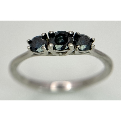 695 - A 9k White Gold Blue Diamond Trilogy Ring, 1.5g total weight, 0.40ct diamond, size N1/2.

ref: 569I