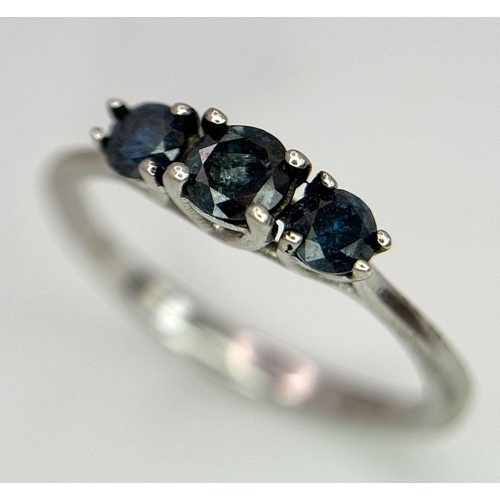 695 - A 9k White Gold Blue Diamond Trilogy Ring, 1.5g total weight, 0.40ct diamond, size N1/2.

ref: 569I