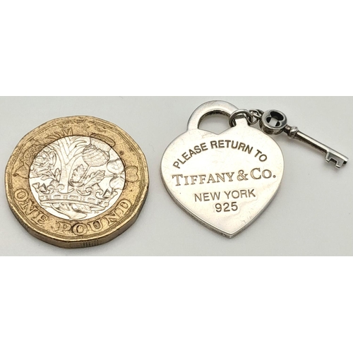 1454 - A Tiffany Love Heart Silver Pendant with Key. 3cm.