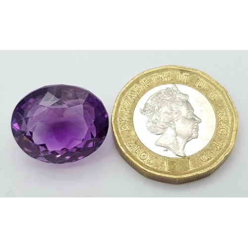 1451 - A 18.25ct Madagascar Natural Amethyst Gemstone, in the Oval Faceted Cut. Comes with the AIG Certific... 