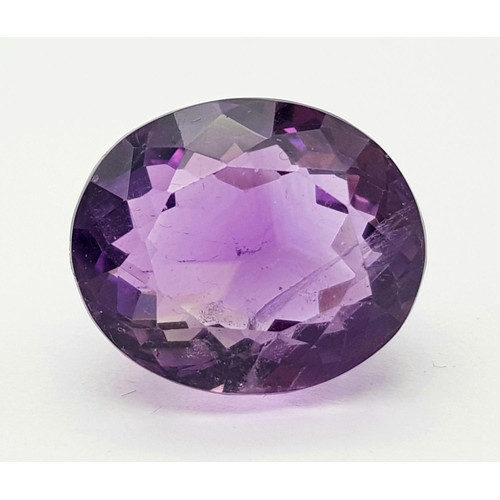 1451 - A 18.25ct Madagascar Natural Amethyst Gemstone, in the Oval Faceted Cut. Comes with the AIG Certific... 