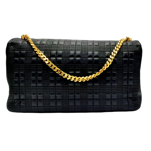 108 - A Burberry Black Leather Hand/Shoulder Bag. Textured exterior with gold tone hardware including curb... 