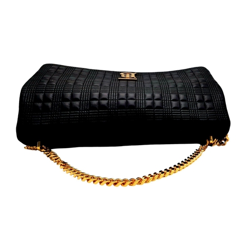 108 - A Burberry Black Leather Hand/Shoulder Bag. Textured exterior with gold tone hardware including curb... 