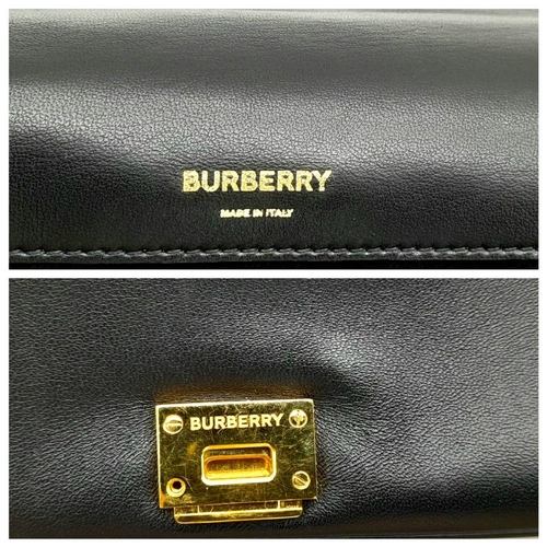 108 - A Burberry Black Leather Hand/Shoulder Bag. Textured exterior with gold tone hardware including curb... 