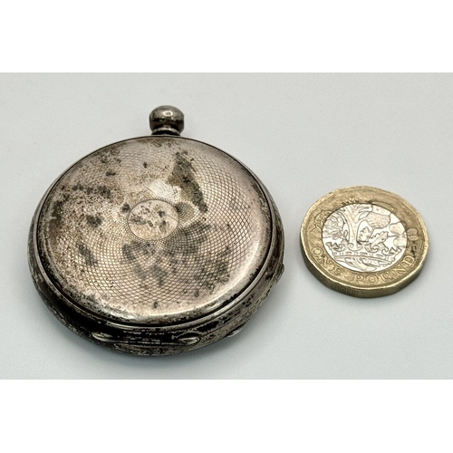 1087 - An Antique Baume White Metal Pocket Watch with Key. Not currently working so as found. 4.5cm.