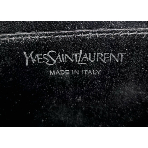 115 - A Yves Saint Laurent Silver Effect Leather Belle de Jour Clutch Bag. Dust cover. Dark textile and le... 