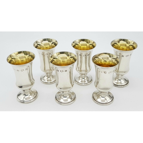 126 - An exceptional, British fully hallmarked, set of six sterling silver Kiddush cups in their original ... 