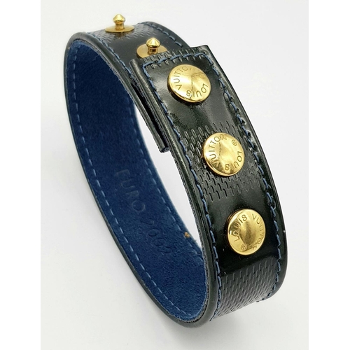 1275 - A Louis Vuitton Leather Bracelet with Gilded Studs.