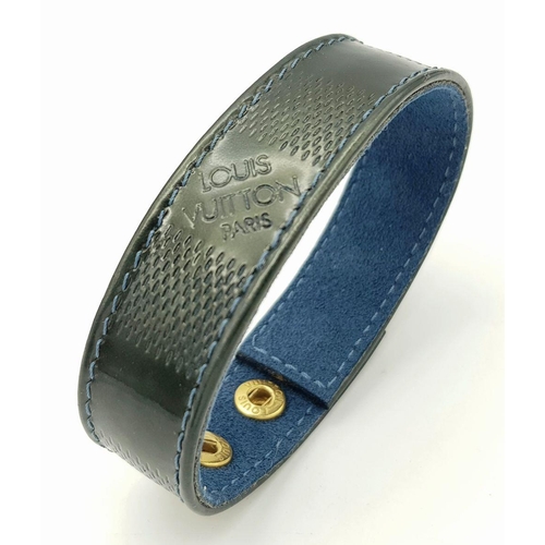 1275 - A Louis Vuitton Leather Bracelet with Gilded Studs.