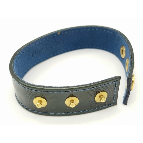 1275 - A Louis Vuitton Leather Bracelet with Gilded Studs.