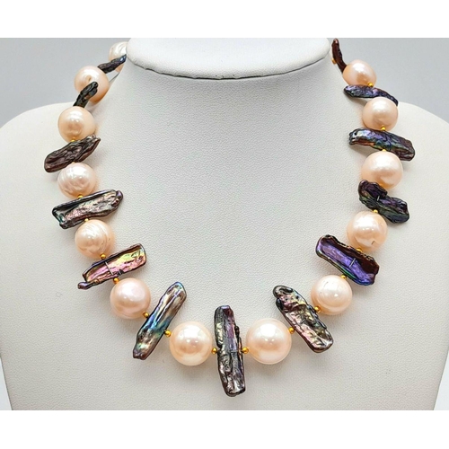 133 - A statement, pearl necklace with large (12-13 mm) cultured, mature, champagne pearls and unusual elo... 