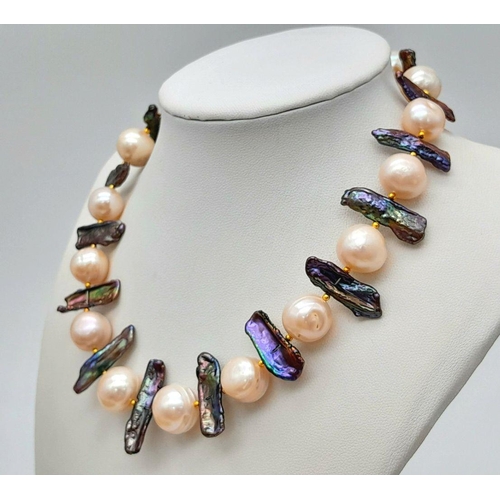 133 - A statement, pearl necklace with large (12-13 mm) cultured, mature, champagne pearls and unusual elo... 