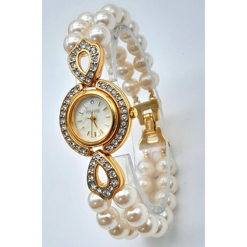 168 - A very collectible, JOAN RIVERS glamorous watch with cubic zirconia and a double shell pearl bracele... 