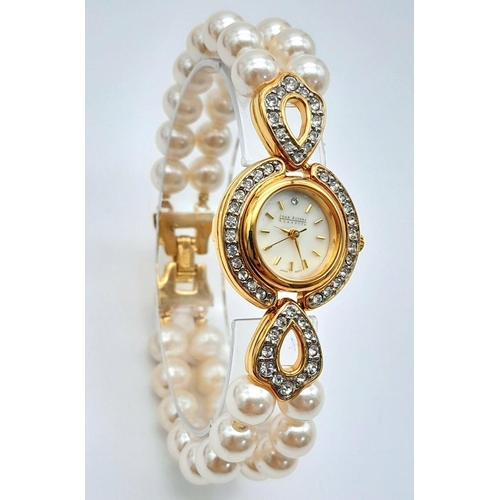 168 - A very collectible, JOAN RIVERS glamorous watch with cubic zirconia and a double shell pearl bracele... 