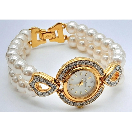 168 - A very collectible, JOAN RIVERS glamorous watch with cubic zirconia and a double shell pearl bracele... 