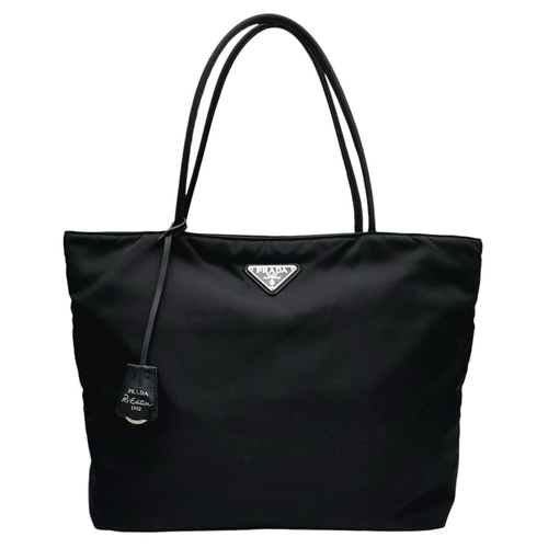 192 - A Prada Black Nylon Tote Bag. Prada badge exterior. Textile interior with zipped and open compartmen... 