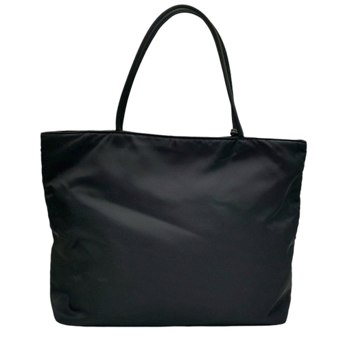 192 - A Prada Black Nylon Tote Bag. Prada badge exterior. Textile interior with zipped and open compartmen... 