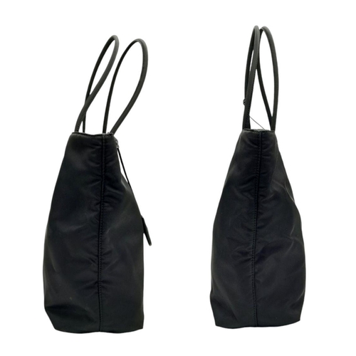 192 - A Prada Black Nylon Tote Bag. Prada badge exterior. Textile interior with zipped and open compartmen... 