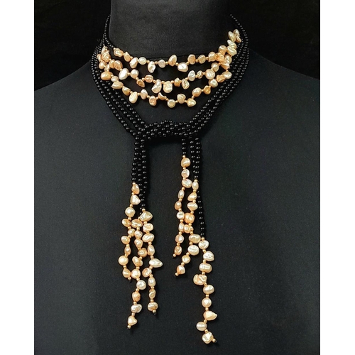 203 - A long, three strand, black onyx and cream coloured Keshi pearl necklace that can be worn in several... 